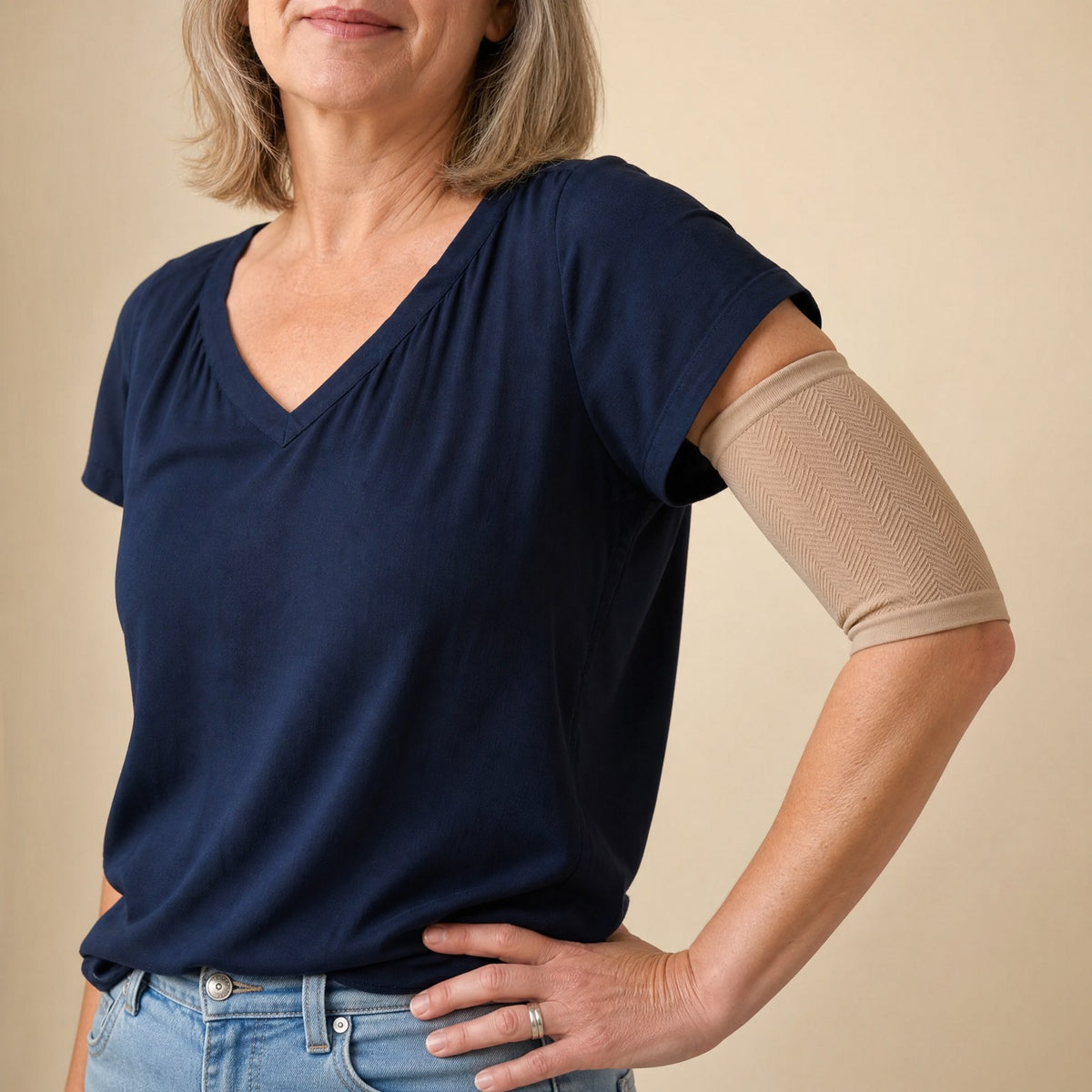 Beige smooth arm sleeve worn on the upper arm