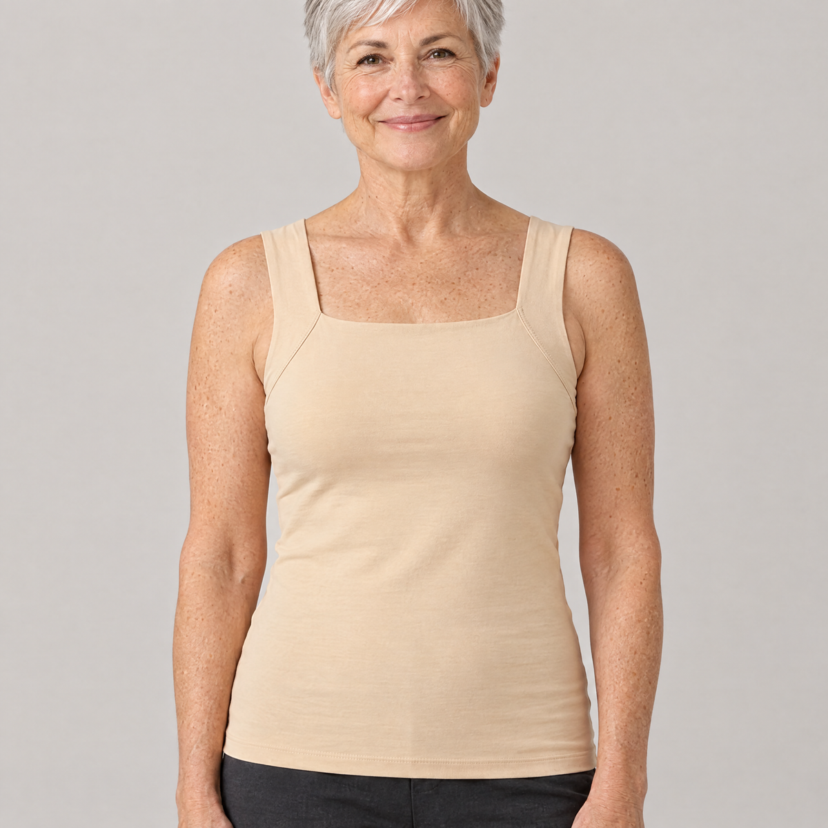 Woman wearing the Shapova Comfort Tank with built-in bra in nude, front view