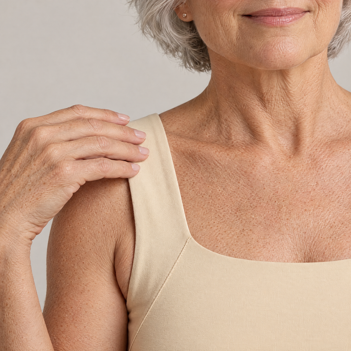 Close-up of the wide soft strap and square neckline